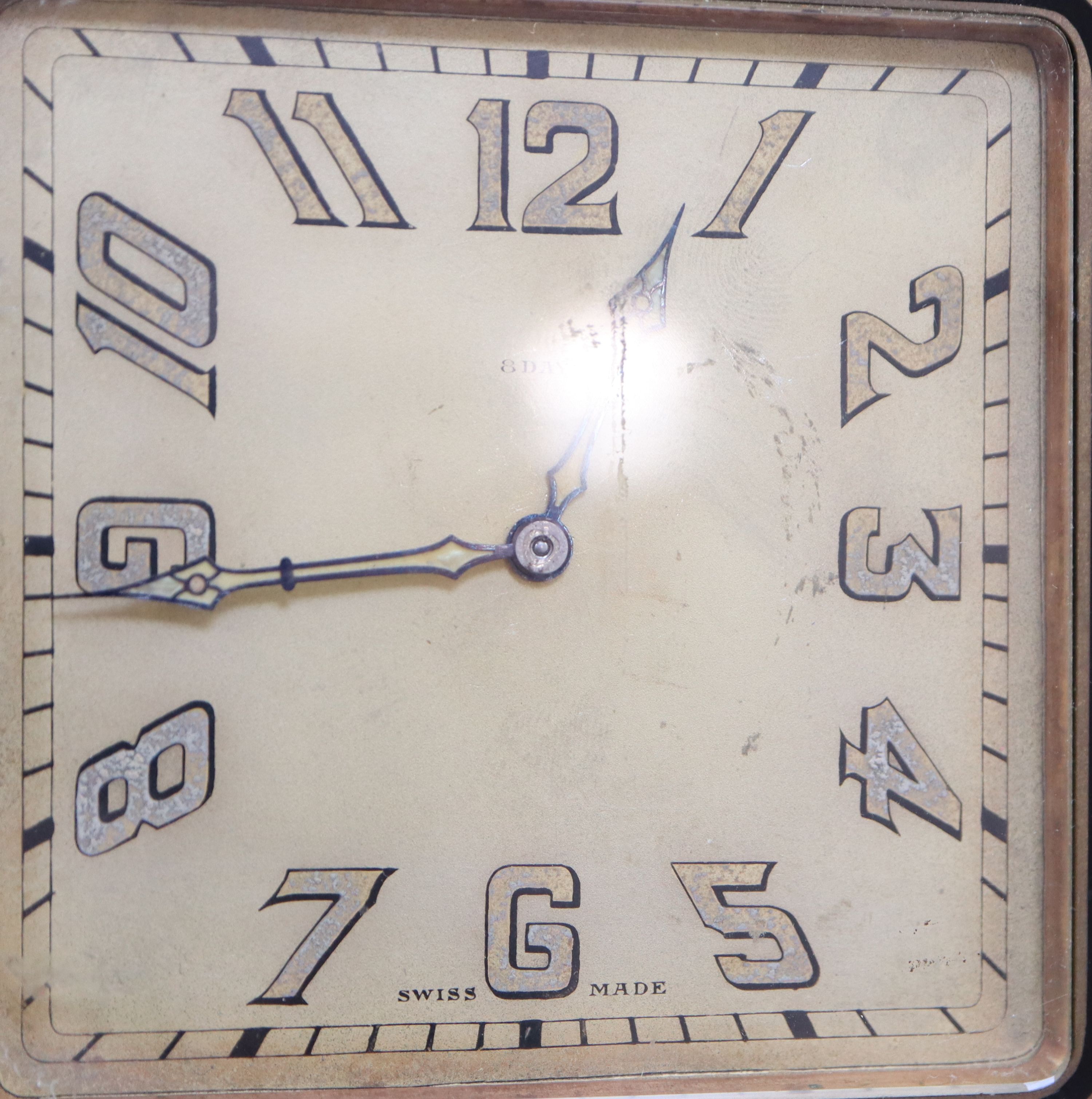 A mid 20th century Swiss enamelled brass eight day travelling timepiece, 10.5cm